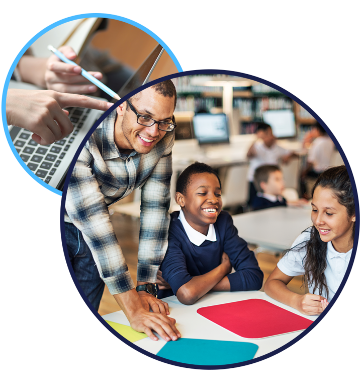 Teacher leaning over table with two pupils.